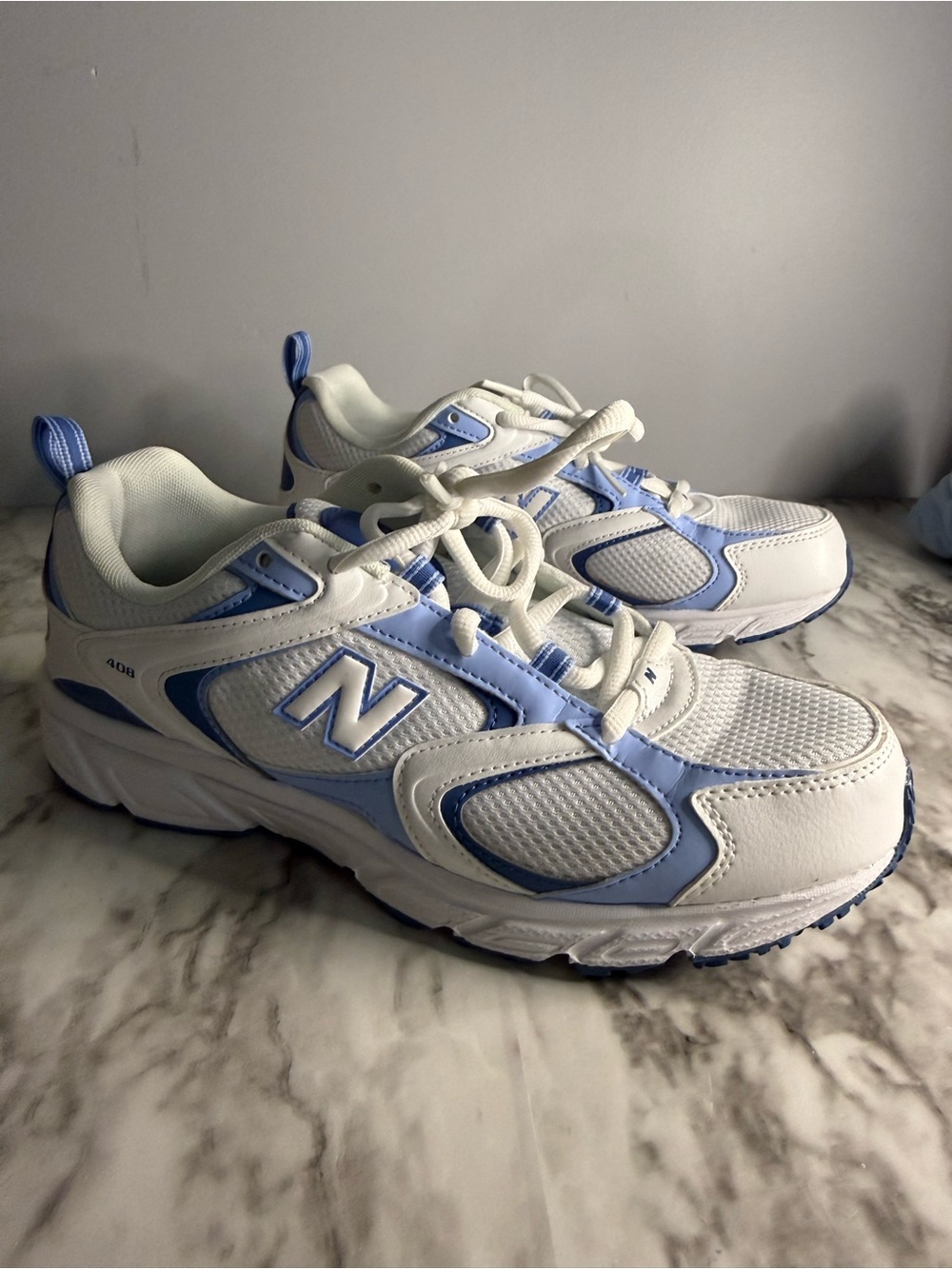 New Balance men’s White & Light Blue Athletic Sneakers